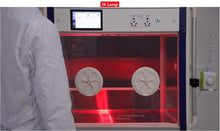 Load image into Gallery viewer, The ICU 160 shown with the IR-lamp lighting on giving the interior a red glow.